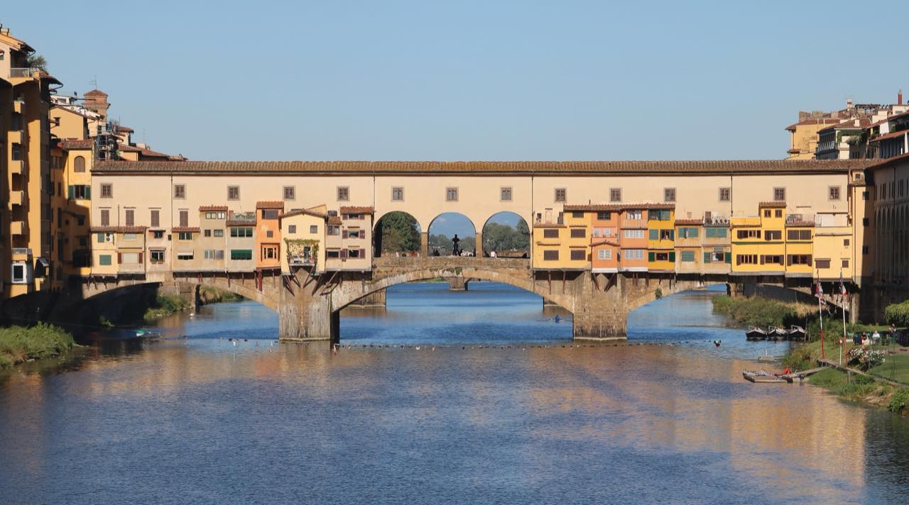 The photograph just taken of the Ponte Vecchio, seen head on from the Arno with its ochre shops over the three arches.